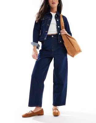 ASOS DESIGN - Schmal zulaufende Jeans in Raw-Waschung mit elastischer Taille-Marineblau