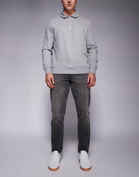 ASOS DESIGN – Schmal zulaufende Jeans in schwarzer Waschung mit Farbstich - view 1