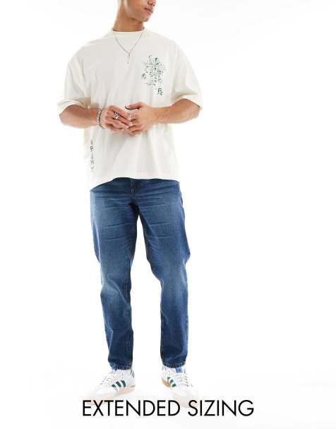 ASOS DESIGN – Schmal zulaufende Jeans in verwaschenem Dunkelblau - view 1