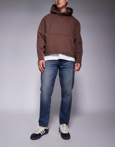ASOS DESIGN – Schmal zulaufende Jeans in verwaschenem Dunkelblau - view 1