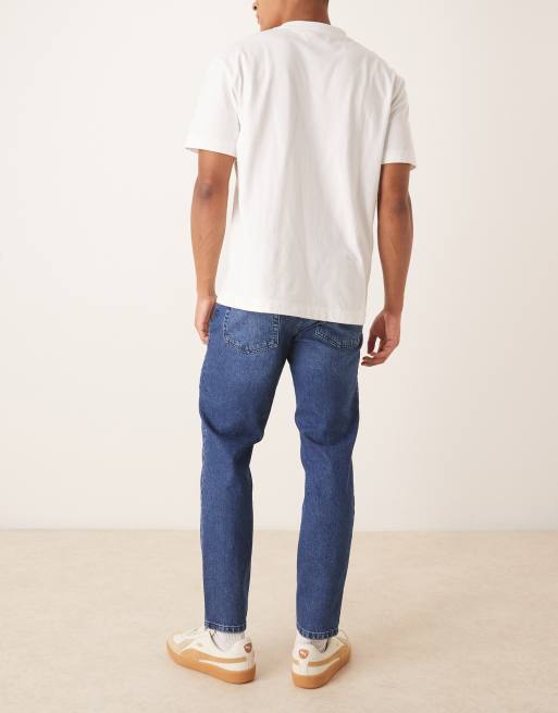 ASOS DESIGN – Schmal zulaufende Jeans in verwaschenem Dunkelblau, 2 von 5