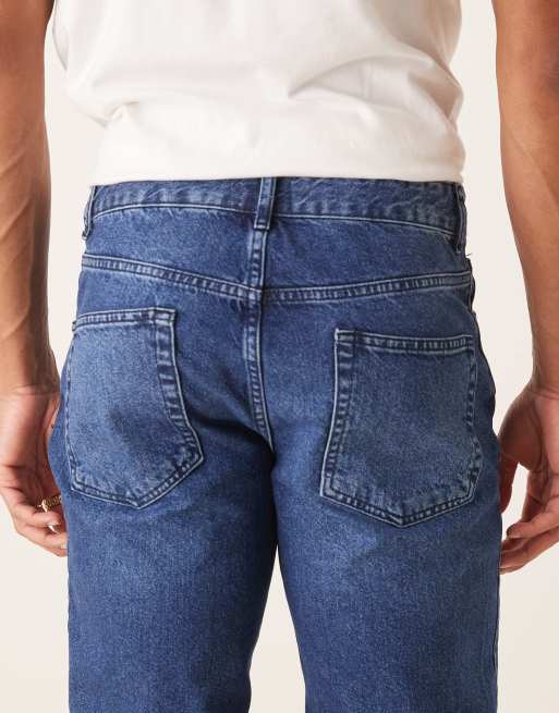 ASOS DESIGN – Schmal zulaufende Jeans in verwaschenem Dunkelblau, 4 von 5