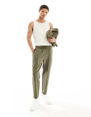 ASOS DESIGN – Schmal zulaufende Jogginghose aus Neopren in Khaki 
