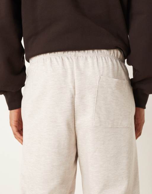 ASOS DESIGN – Schmal zulaufende Jogginghose aus neoprenartigem Material in meliertem Hellbeige, 5 von 5
