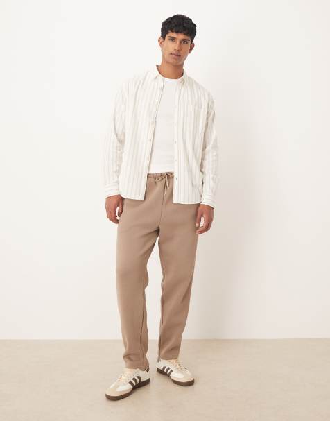 ASOS DESIGN – Schmal zulaufende Jogginghose in Beige mit lockerem Schnitt, Kombiteil - view 1