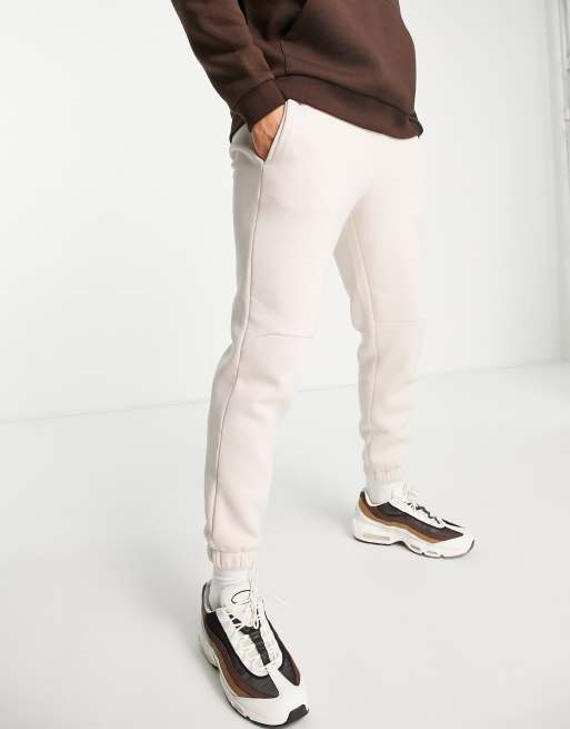 ASOS DESIGN – Schmal zulaufende Jogginghose in Beige