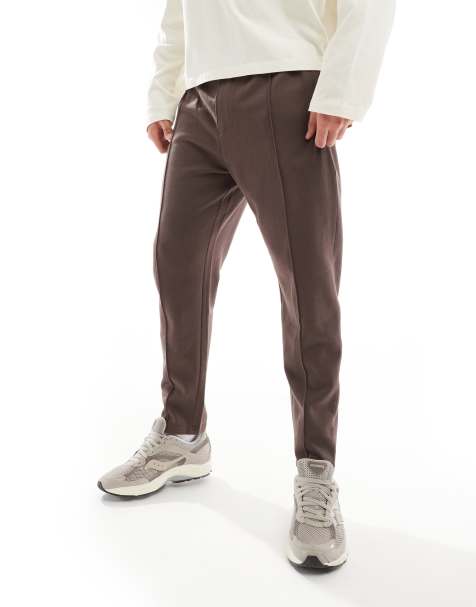 ASOS DESIGN – Schmal zulaufende Jogginghose in Braun mit Reißverschluss - view 1