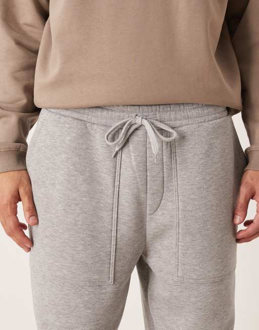 ASOS DESIGN – Schmal zulaufende Jogginghose in Grau meliert mit Taschen, Kombiteil, 4 von 5