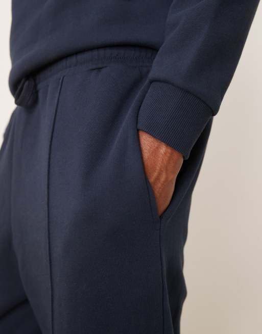 ASOS DESIGN – Schmal zulaufende Jogginghose in Marineblau mit Biesen, Kombiteil, 5 von 5