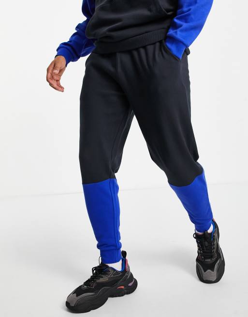 ASOS DESIGN – Schmal zulaufende Jogginghose mit Blockfarbendesign in leuchtenden Farben, Kombiteil