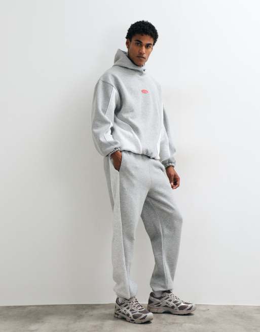 ASOS DESIGN schmal zulaufende Jogginghose mit Cut-and-Sew und Paspelierung in Grau-Meliert, 2 von 5