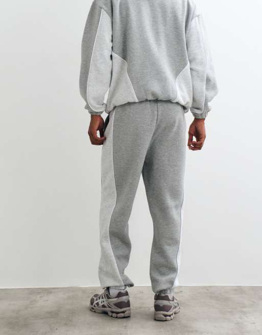 ASOS DESIGN schmal zulaufende Jogginghose mit Cut-and-Sew und Paspelierung in Grau-Meliert, 3 von 5
