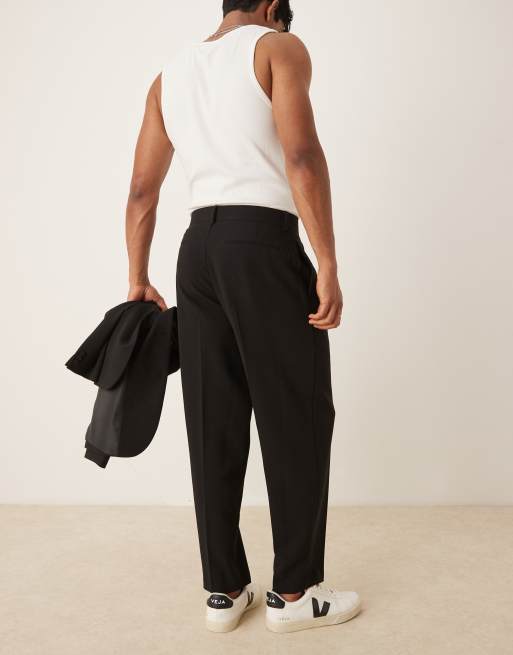 ASOS DESIGN – Schmal zulaufende Oversize-Anzughose in Schwarz, 3 von 5