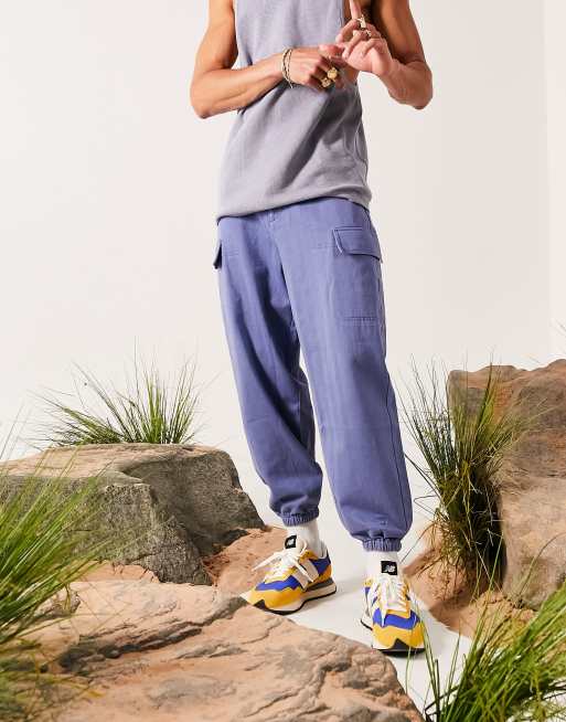 ASOS DESIGN – Schmal zulaufende Oversize-Hose in Blau