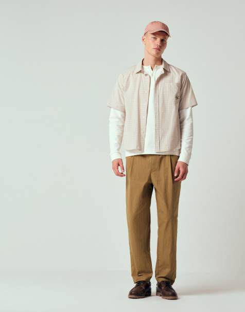 ASOS DESIGN – Schmal zulaufende Oversize-Hose in Hellbraun aus Funktionsmaterial mit Bundfalten, Kombiteil - view 1