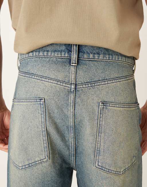 ASOS DESIGN – Schmal zulaufende Relaxed-Fit-Jeans in dunkelblauer Waschung mit Farbstich, 5 von 5