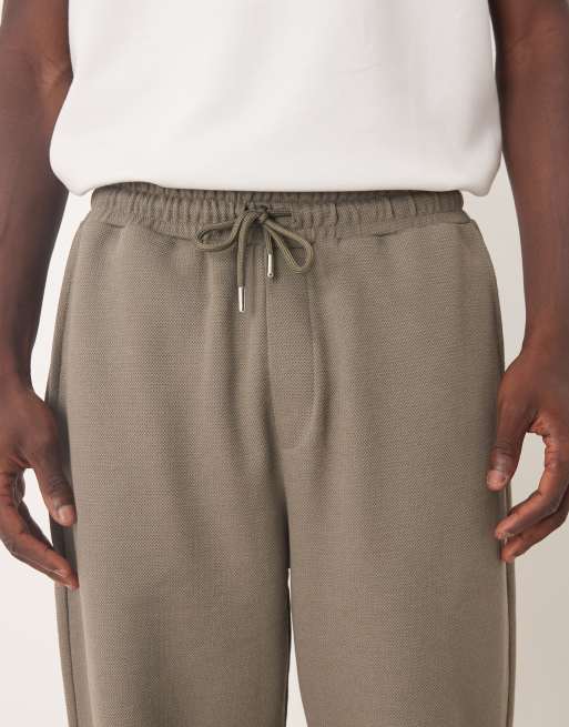 ASOS DESIGN – Schmal zulaufende Relaxed-Fit-Jogginghose aus Baumwollpikee in Khaki, 4 von 5
