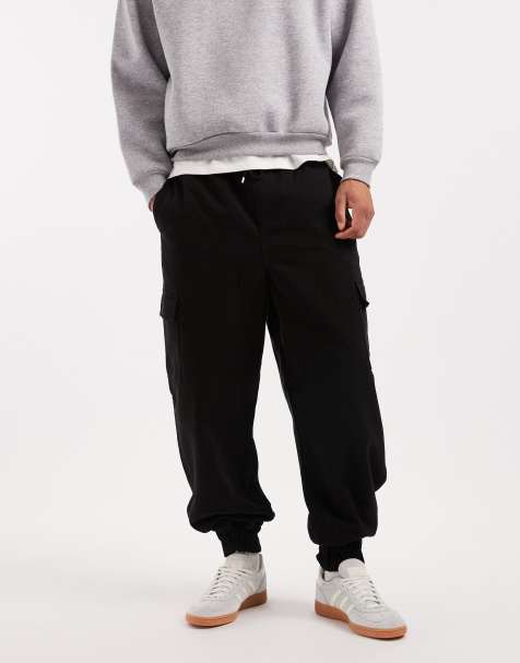 ASOS DESIGN – Schmal zulaufende Schlupf-Cargohose in Schwarz - view 1