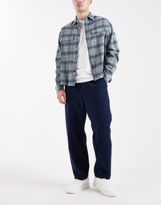 ASOS DESIGN – Schmal zulaufende Schlupfhose in Marineblau mit Biesen, 2 von 5