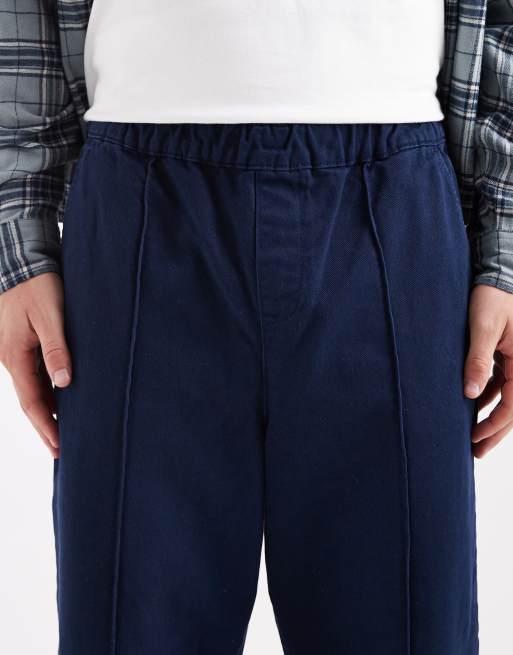 ASOS DESIGN – Schmal zulaufende Schlupfhose in Marineblau mit Biesen, 5 von 5