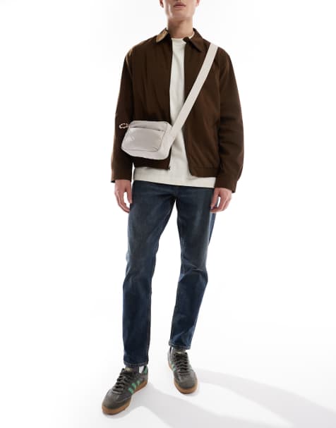 ASOS DESIGN – Schmal zulaufende Stretch-Jeans in dunkelblau getönter Waschung - view 1