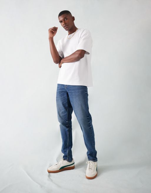 ASOS DESIGN – Schmal zulaufende Stretch-Jeans in dunkler Waschung 