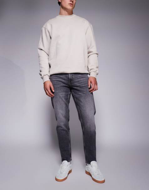 ASOS DESIGN – Schmal zulaufende Stretch-Jeans in hellgrauer Waschung - view 1