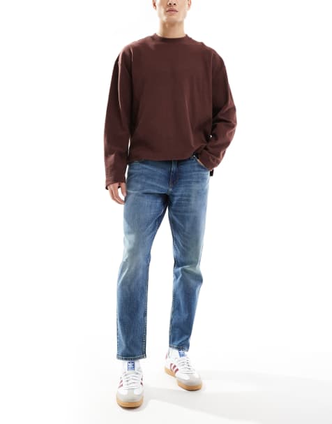 ASOS DESIGN – Schmal zulaufende Stretch-Jeans in verwaschenem Dunkelblau - view 1