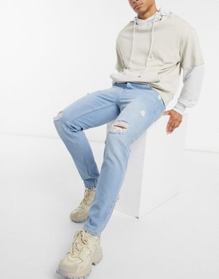 ASOS DESIGN – Schmale Jeans in hellblauer Waschung mit starken Rissen