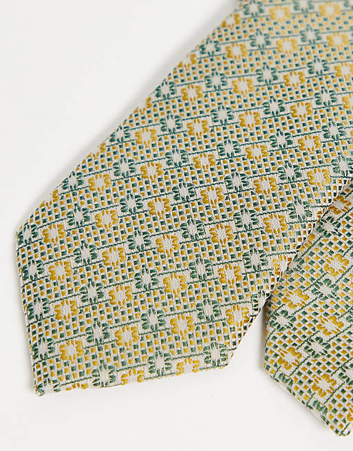 ASOS DESIGN – Schmale Krawatte in Retro-Grün mit geometrischem Muster | ASOS
