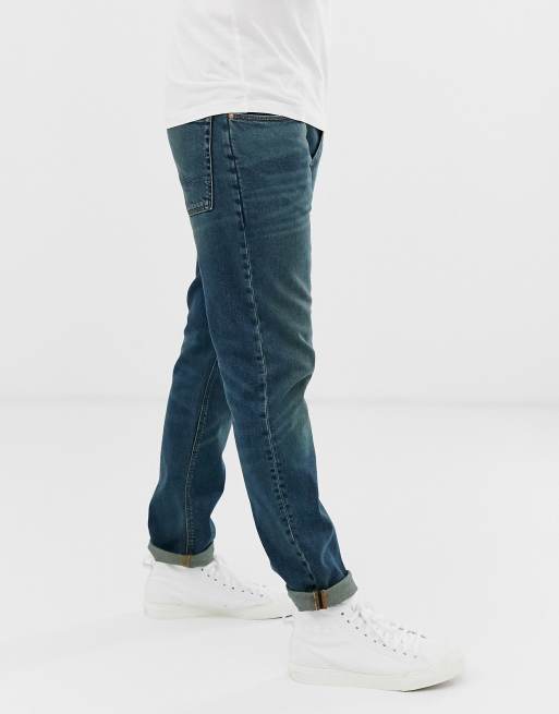 ASOS DESIGN – Schmale Stretch-Jeans in dunkelblauer Vintage-Waschung, 2 von 4