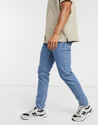 ASOS DESIGN – Schmale Stretch-Jeans in verwaschenem Mittelblau