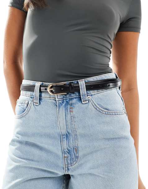 ASOS DESIGN – Schmaler Hüft- und Taillen-Jeansgürtel in Schwarz mit goldfarbener Schnalle - view 1