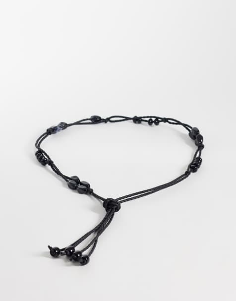 ASOS DESIGN – Schmaler Taillen- und Hüftgürtel in Schwarz mit Makramee-Design und Perlenverzierung - view 1