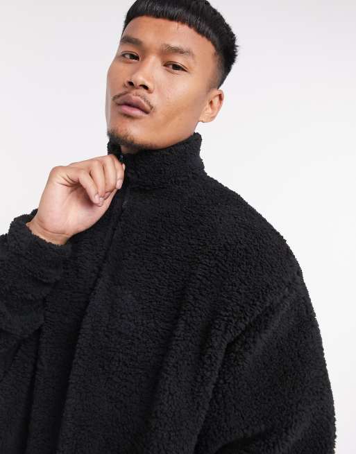 ASOS DESIGN – Schwarzes Oversize-Sweatshirt aus Teddymaterial mit kurzem Reißverschluss am Ausschnitt