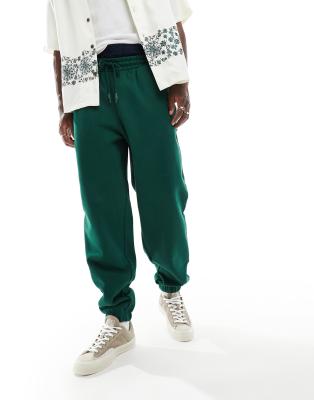 ASOS DESIGN – Schwere Oversize-Jogginghose in Dunkelgrün