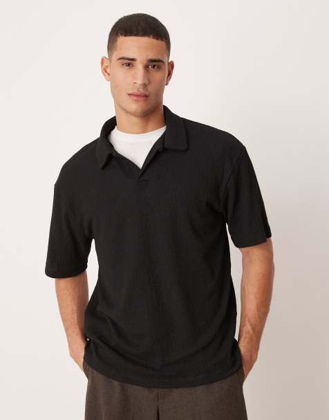 ASOS DESIGN – Schweres, geripptes Relaxed-Fit-Polohemd in Schwarz mit Knitterstruktur - view 1