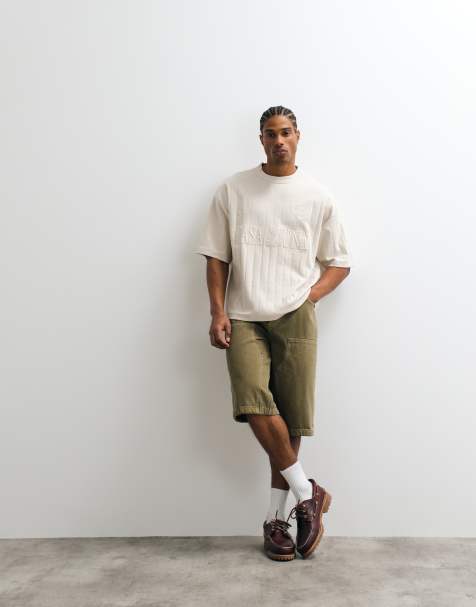 ASOS DESIGN – Schweres, kastiges Oversize-T-Shirt in strukturiertem Beige mit Fußball-Stickerei auf der Brust - view 1