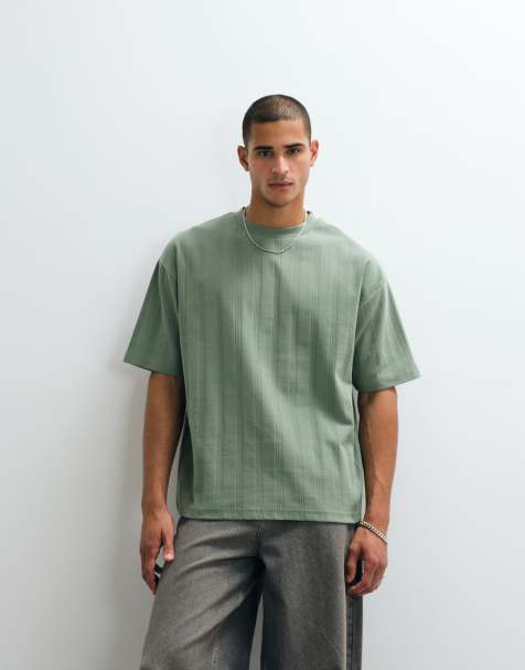 ASOS DESIGN – Schweres Oversize-T-Shirt aus strukturiertem Stoff in Grün mit Text- und Grafikprint auf dem Rücken - view 1