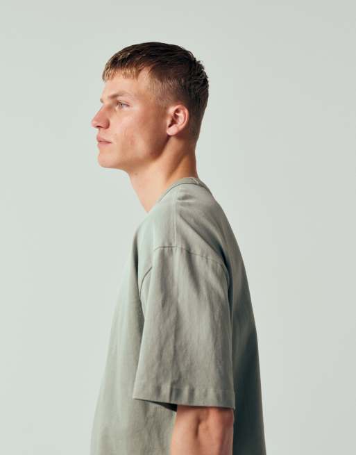 ASOS DESIGN – Schweres Oversize-T-Shirt in khaki Waschung mit Print auf der Vorderseite, 5 von 12