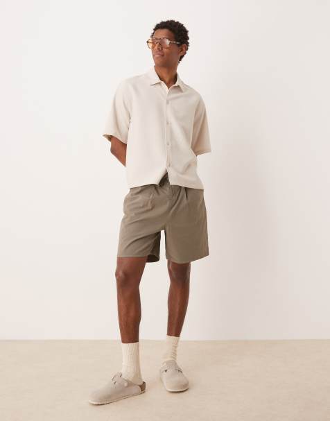 ASOS DESIGN wide mid length pleated shorts with drawstring in khaki