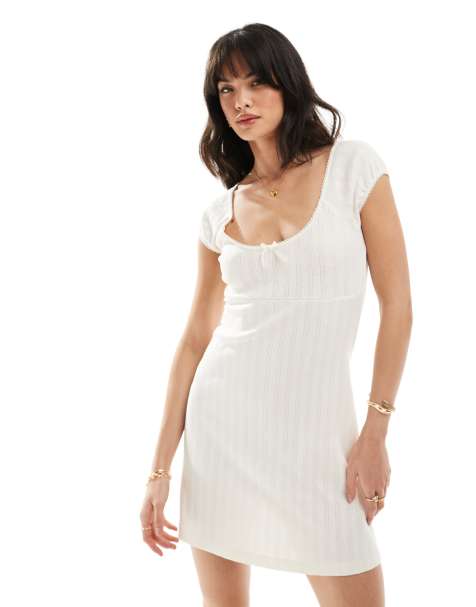 ASOS DESIGN scoop neck pointelle mini dress with bow detail in white - view 1