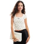 [ASOS DESIGN] ASOS DESIGN scoop neck tiered baby tee with bow print in cream-White L CREAM