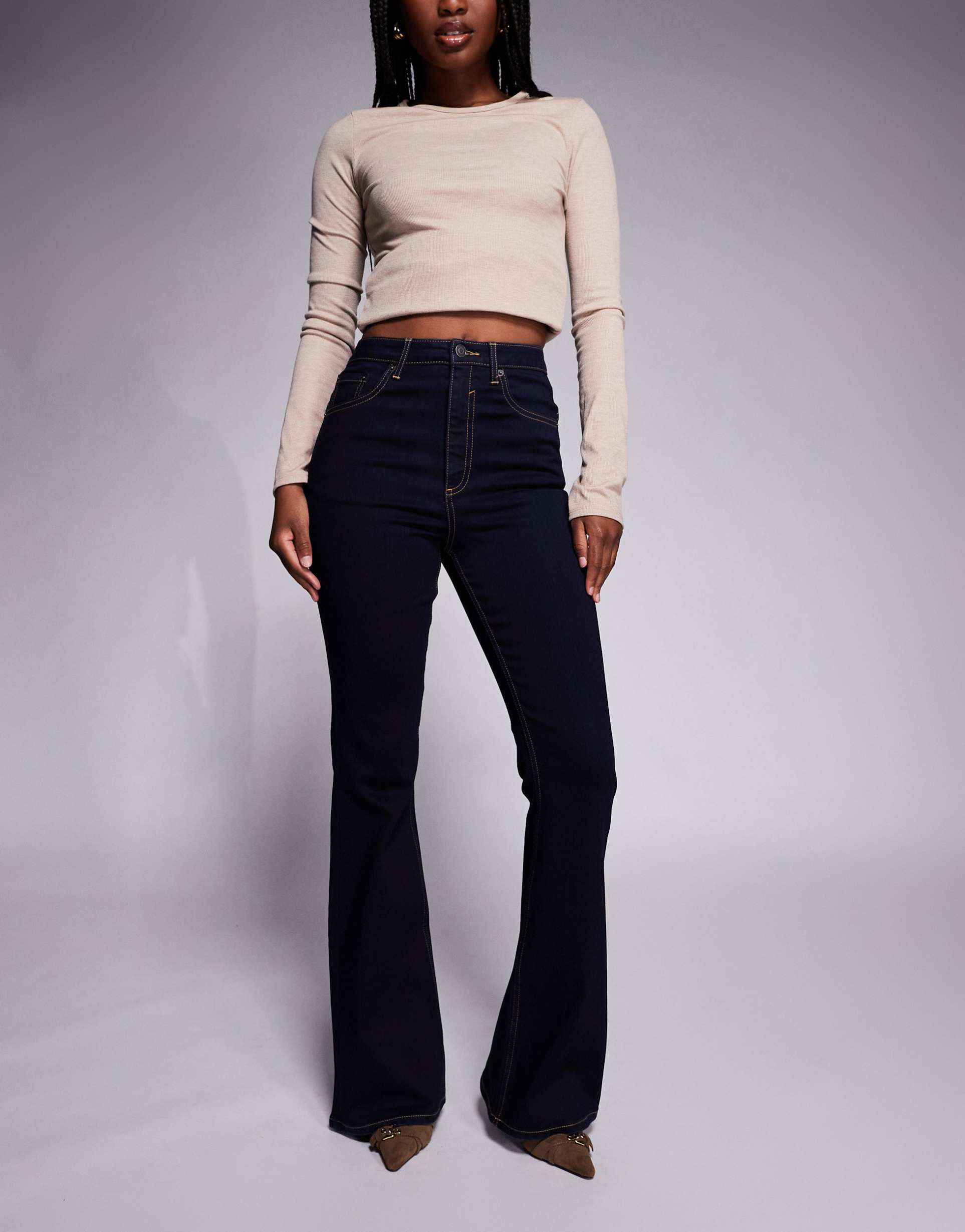 asos design sculpting super stretch flare jeans in rinse
