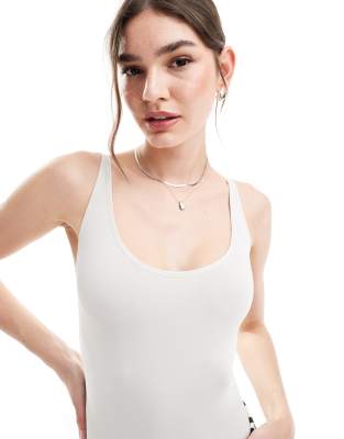 Shop Asos Design Seamless Wide Scoop Neck Minimal Bodysuit In White-brown