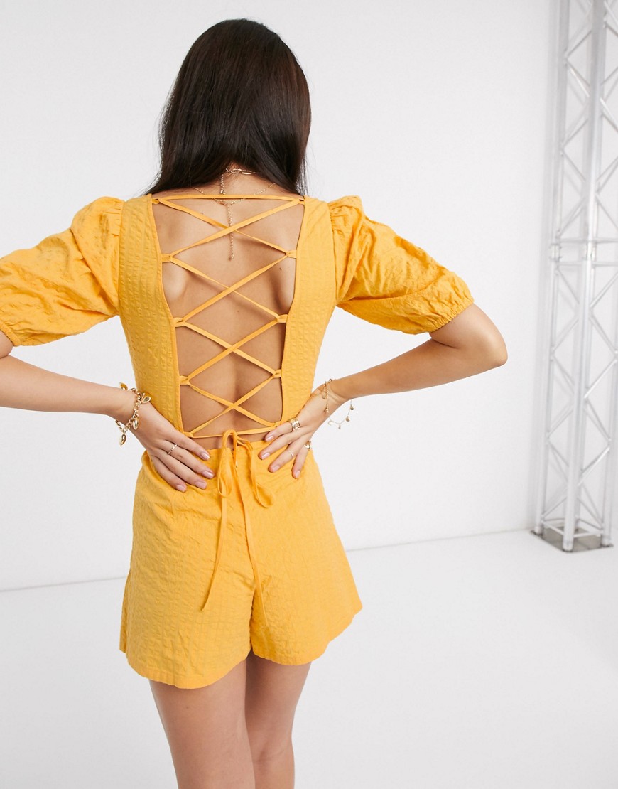 Product photo of Asos design seersucker lace up back playsuit in yellow - multi
