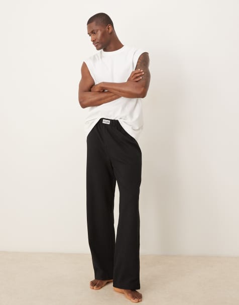 ASOS DESIGN seersucker lounge bottoms with woven patch in black - view 1