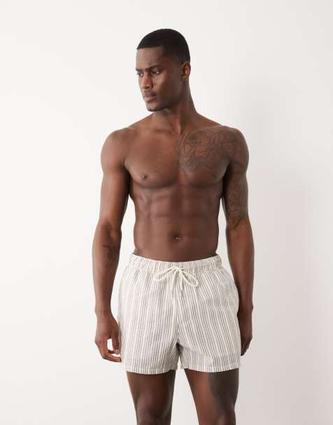ASOS DESIGN seersucker stripe swim shorts in short length in beige - view 1