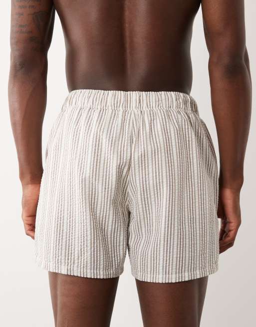 ASOS DESIGN seersucker striped swim shorts in short length in beige, 5 of 5