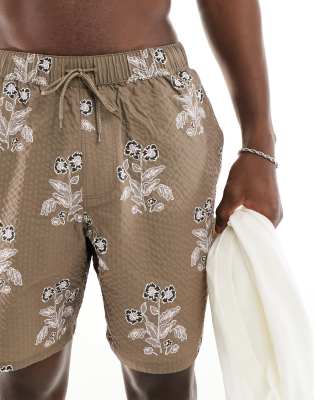 ASOS DESIGN seersucker swim shorts in mid length in brown floral print